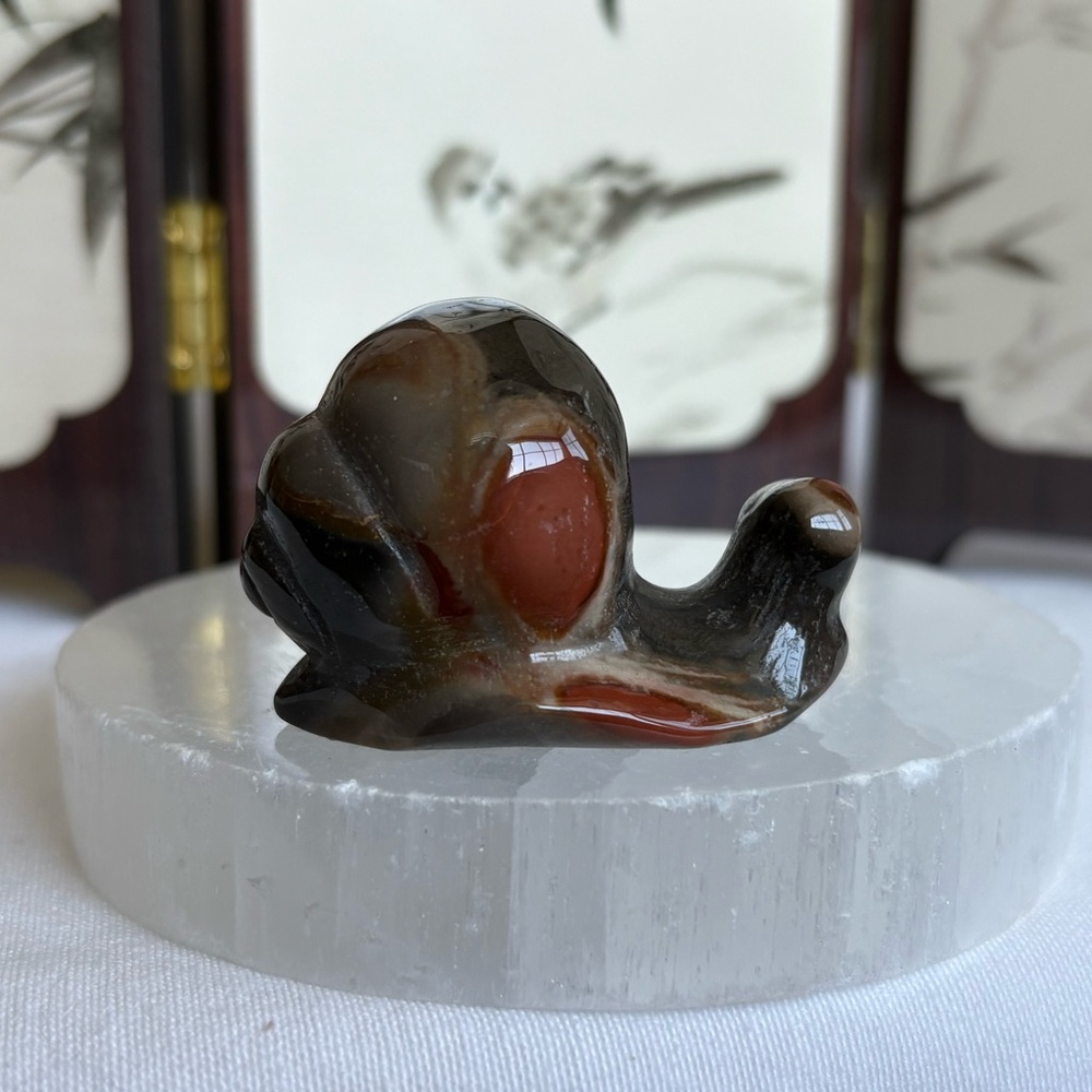 Polychrome crystal snail carving